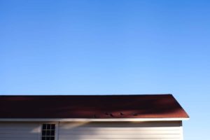 Blue skies and a house roof